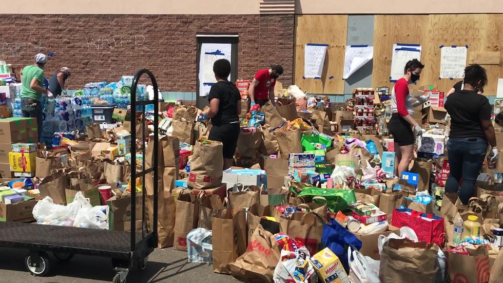 'This is community looking out for the community' Minneapolis volunteers organise as George Floyd protests close stores