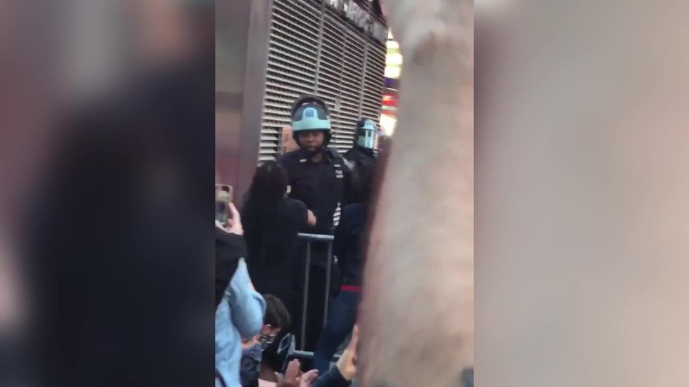 New York police filmed kneeling with protesters