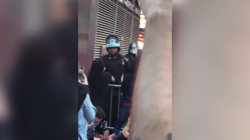 New York police filmed kneeling with protesters
