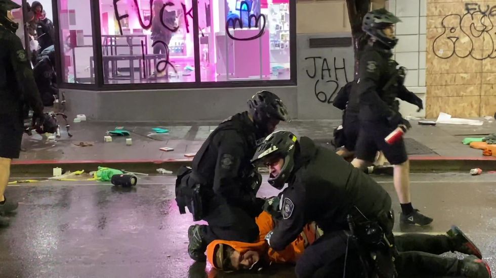 Seattle police officer caught kneeling on the necks of multiple George Floyd protestors