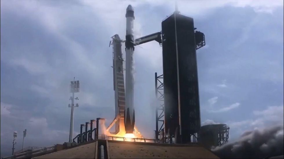 Nasa astronauts launched into space in historic SpaceX mission