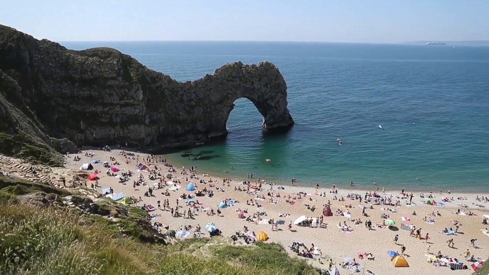 Sunbathers head to Durdle Door following easing of lockdown measures
