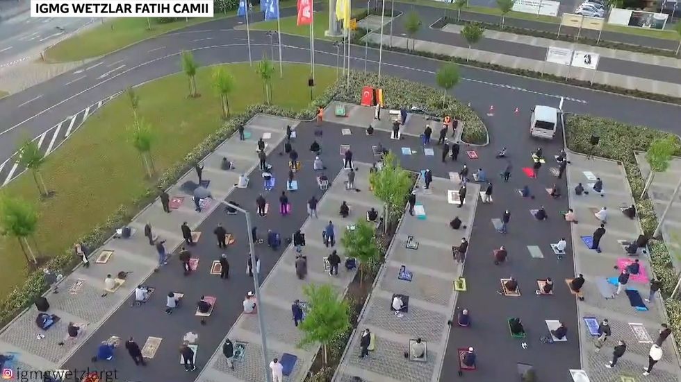 Hundreds of Muslims gather for socially-distanced prayer in Ikea car park