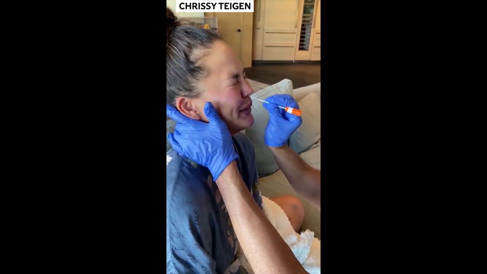 Chrissy Teigen has at-home coronavirus test ahead of surgery