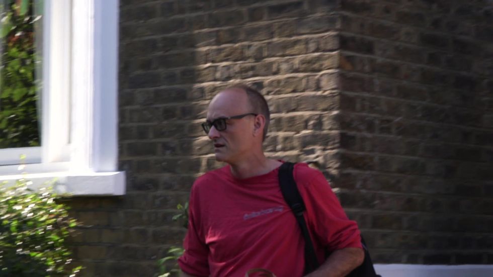 Dominic Cummings greeted by reporter scrum as he leaves his home in north London