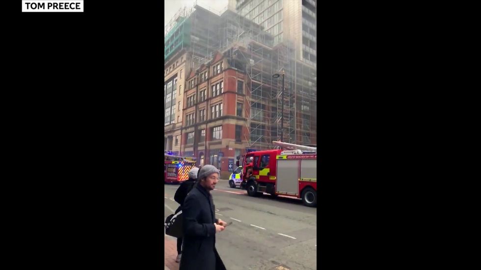 Fire rages at Manchester tower block