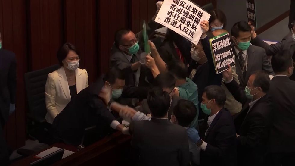 Scuffles break out between Hong Kong legislators over security freedoms