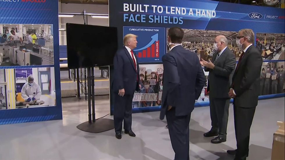 Trump says he did not want press to see him wearing mask