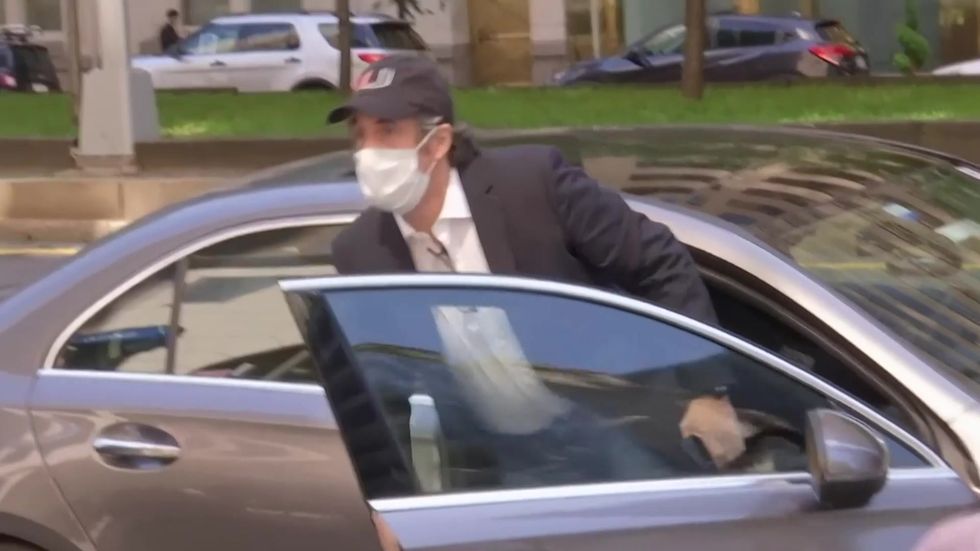 Trump lawyer Michael Cohen arrives home Thursday after being released from federal prison