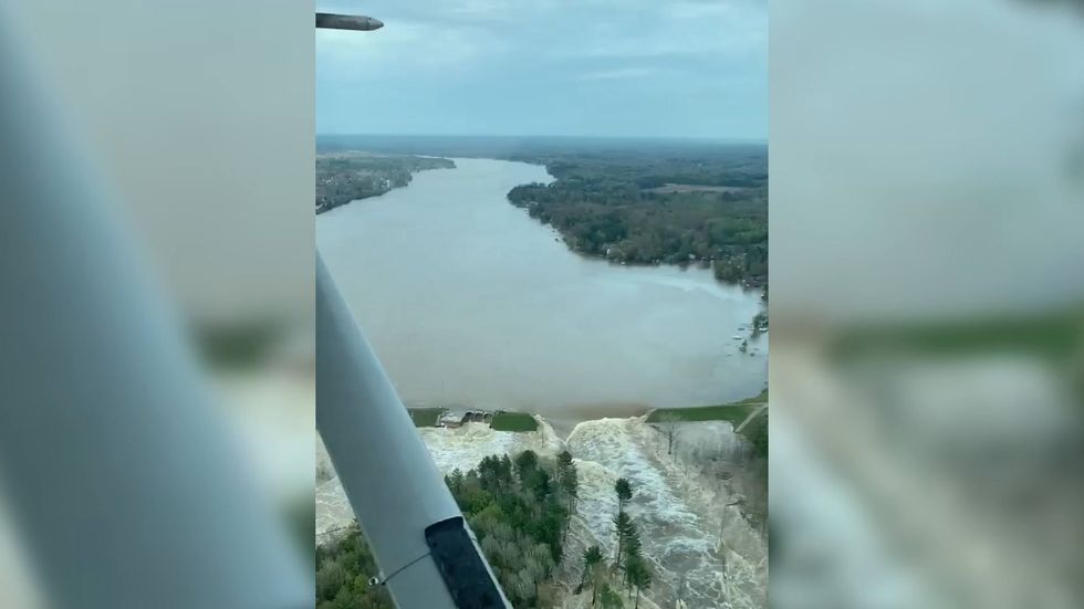 Aerial view of burst dam in Michigan as 10,000 people are evacuated