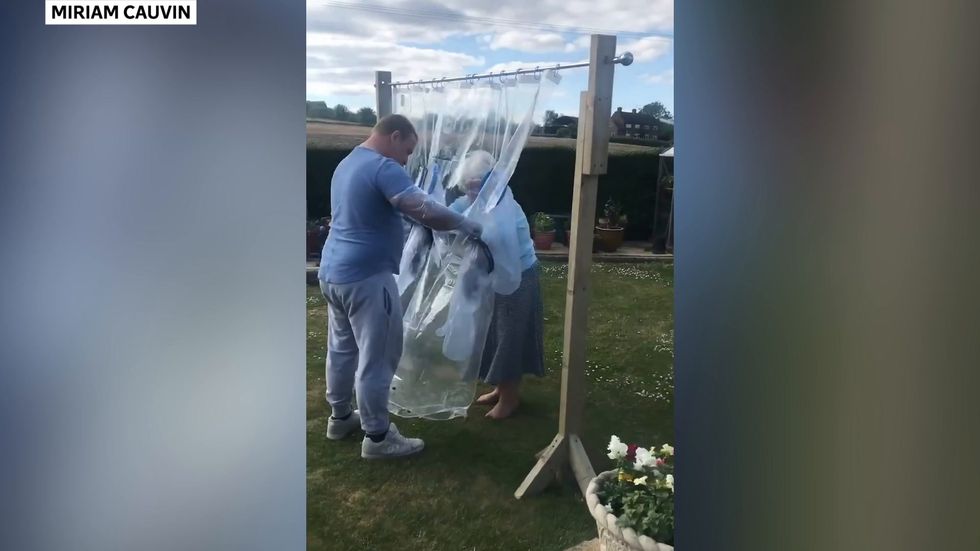 Man creates cuddle curtain to hug his grandmother