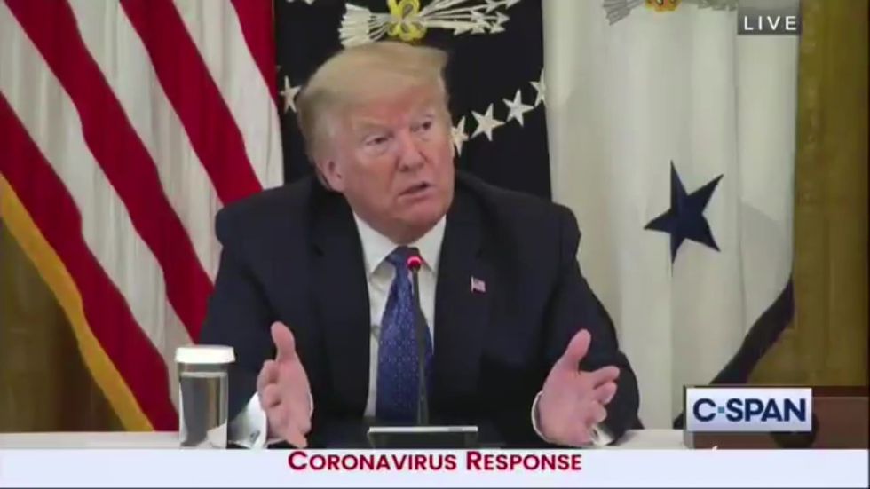 Trump says it's 'badge of honour' for US to lead world in coronavirus cases