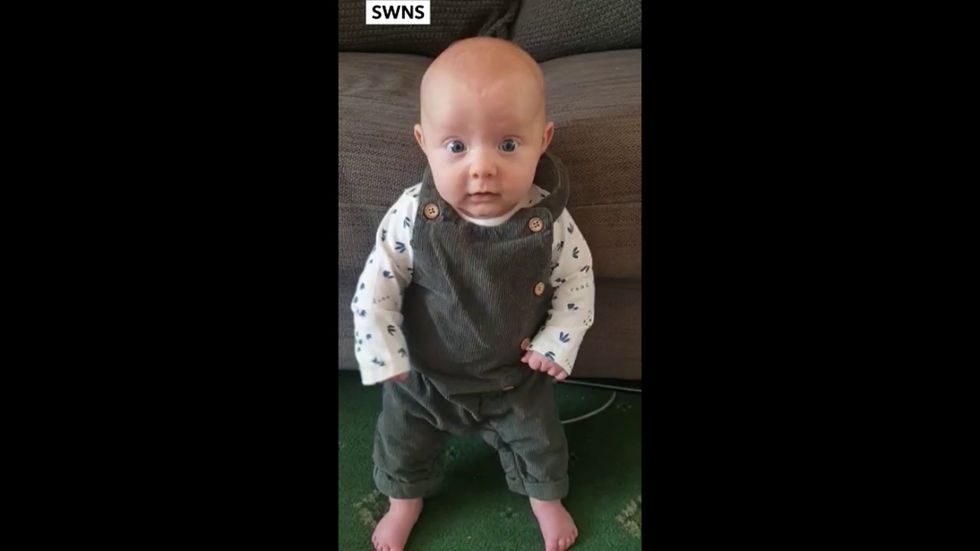 Baby learns to stand up at just 8 weeks old