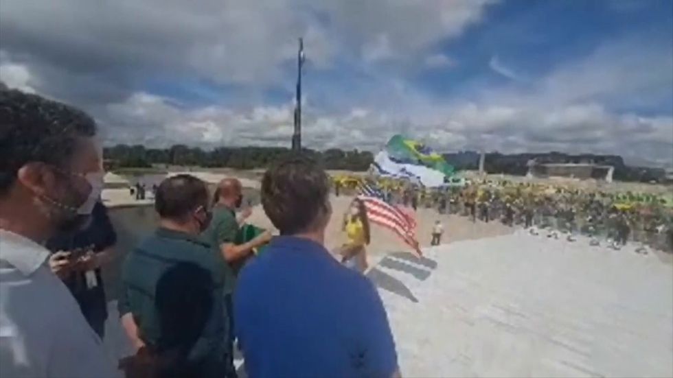Bolsonaro defies health advice to pose with supporters as Brazil becomes fourth most-infected country