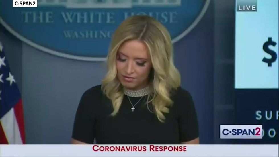 Kaleigh McEnany brandishes two binders to prove Trump's response to the pandemic is better than Obama's