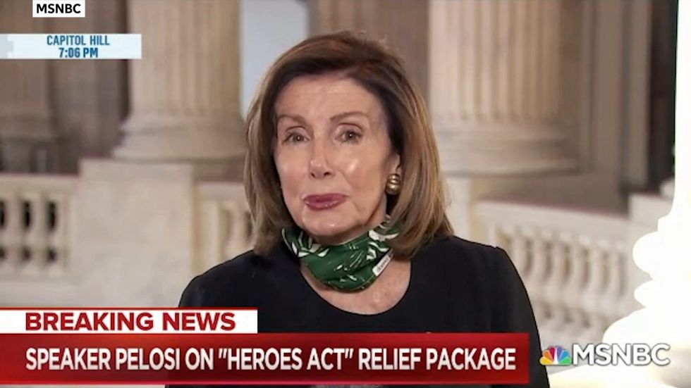 Nancy Pelosi defends massive Covid-19 bill calls GOP tax law a 'scam'