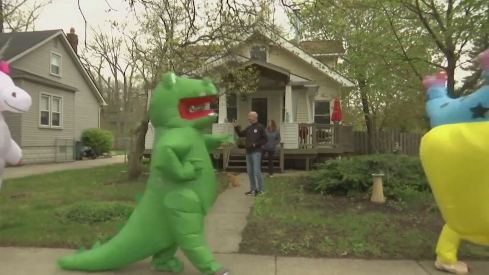 Detroit-area residents lift spirits with costumed parades