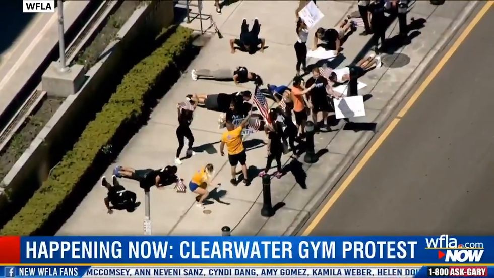 Fitness fanatics in Florida protest gym closures by doing squats and waving protest signs