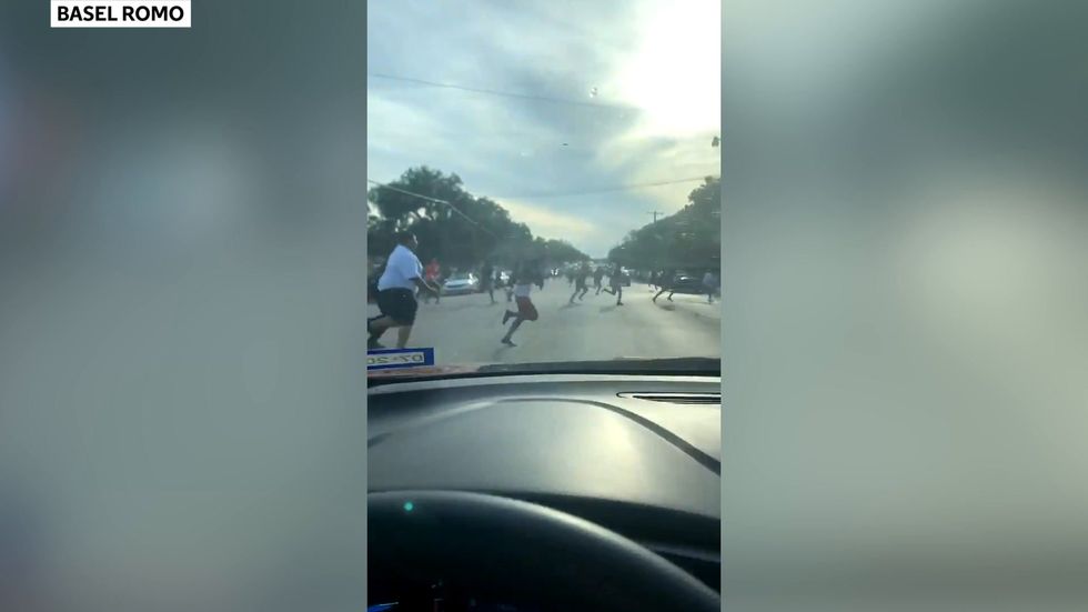 Crowds run from Texas park amid shooting