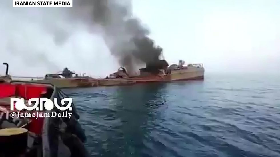 Iranian ship destroyed by own forces smoulders
