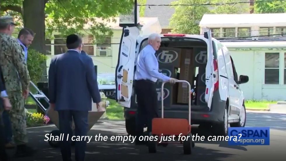 Mike Pence jokes about carrying empty boxes 'for the camera' while delivering PPE