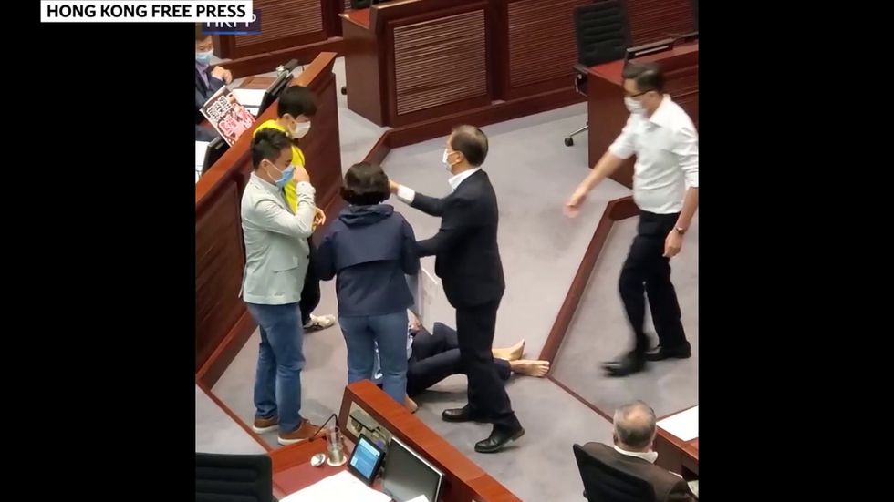 Fights break out in Hong Kong legislature as opposing parties battle over control of house committee