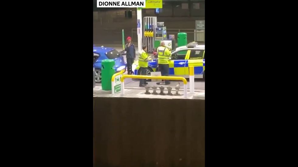 Police taser man in front of his young son at Manchester petrol station