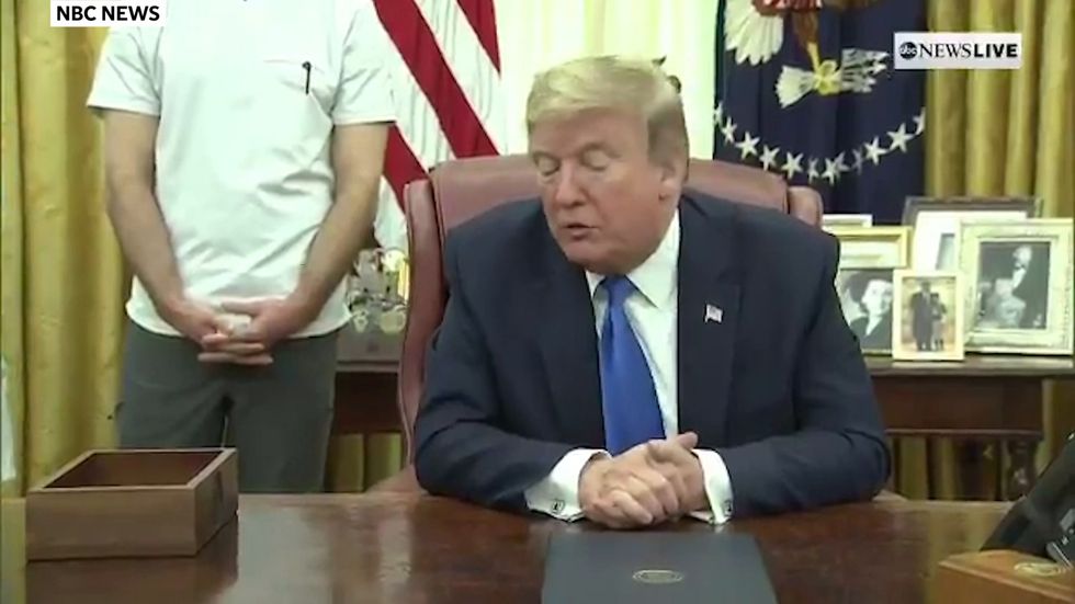 Trump says he changed his mind over task force because it is 'popular'