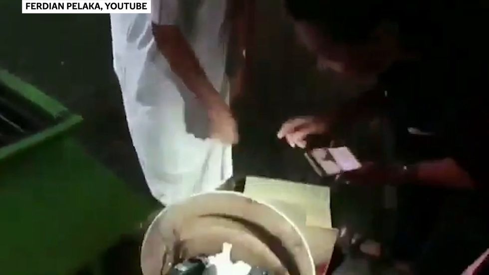 YouTuber pranks homeless people by giving out garbage disguised as food