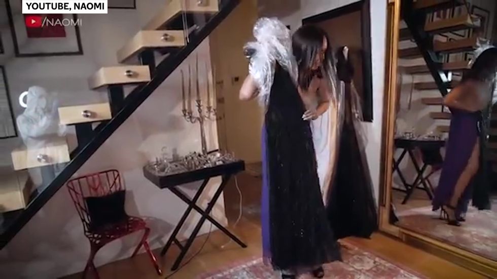 Naomi Campbell uses hazmat suit-wearing cameraman to film YouTube series