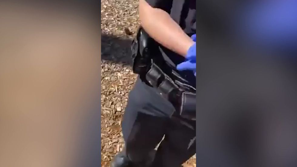 Parents cough at police officers after calling them 'Nazis' in Concord, New Hampshire