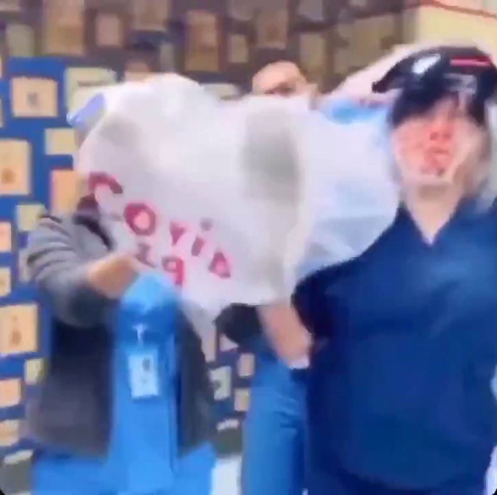 Nurses dance through hospital corridors 'holding Covid-19 bodybag'