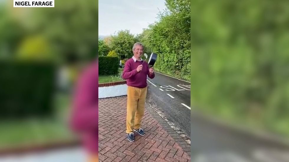 Nigel Farage takes part in clap for carers