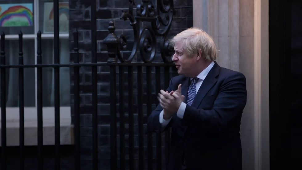 Boris Johnson claps on Downing Street following coronavirus recovery