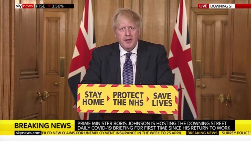 Boris Johnson says UK past coronavirus peak and ‘on downward slope’