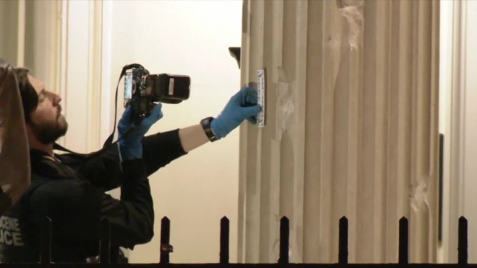 Police inspect damage to Cuban embassy after gunman opens fire in DC