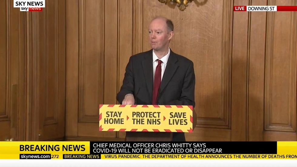 Social distancing could last for at least another year unless vaccine found, chief medical officer suggests