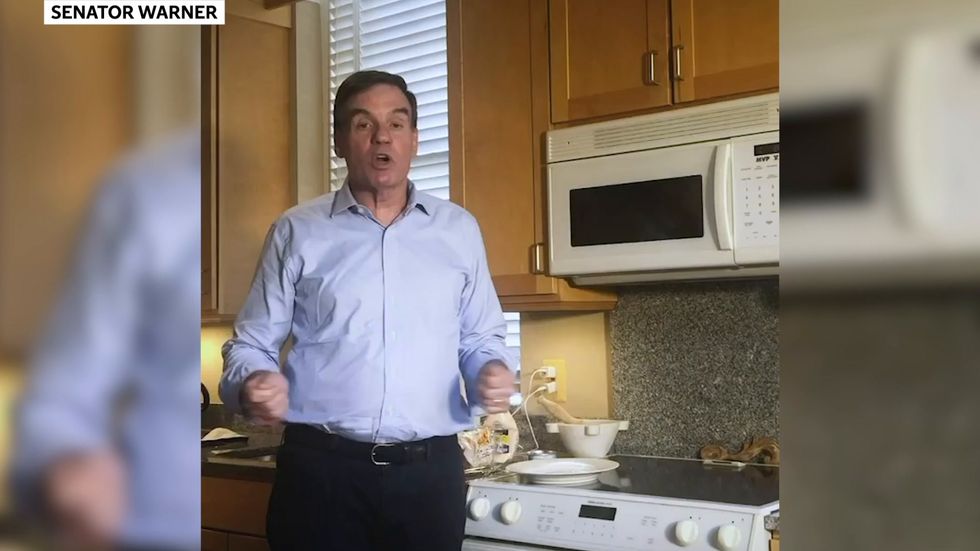 Senator Mark Warner demonstrates who to make a tuna melt sandwich