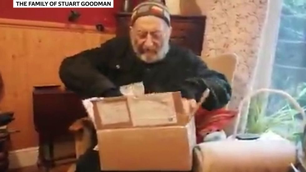 Late photographer and author Stuart Goodman opens books