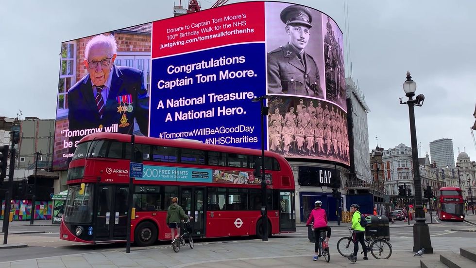 Piccadilly Circus lights up for Captain Tom Moore