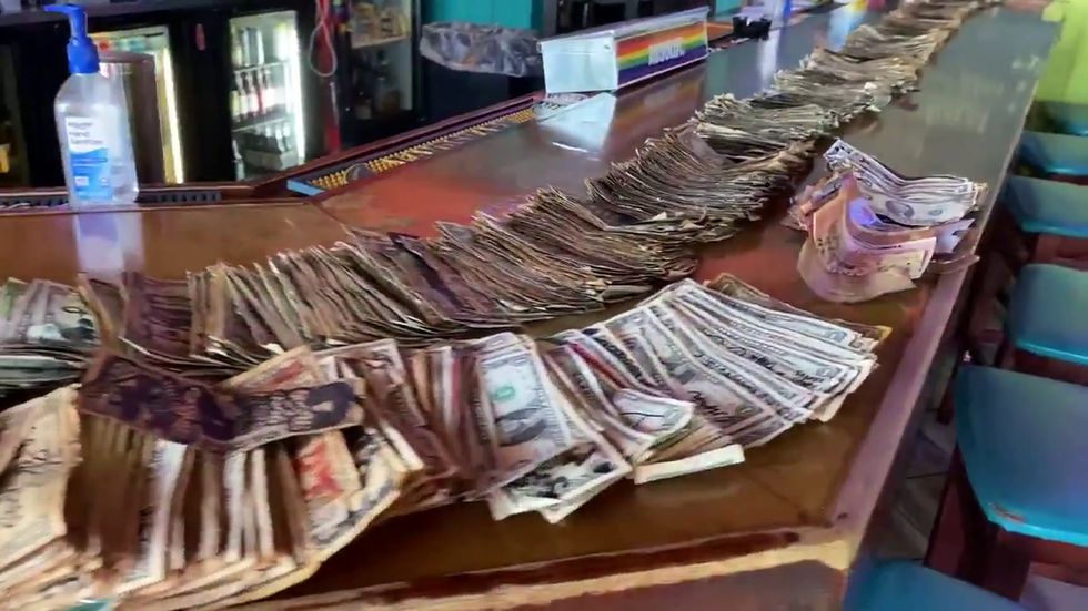 Georgia bar takes thousands of dollars off wall to help coronavirus effort