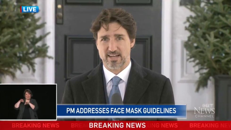 Justin Trudeau says face masks prevent people 'speaking moistly' on each other