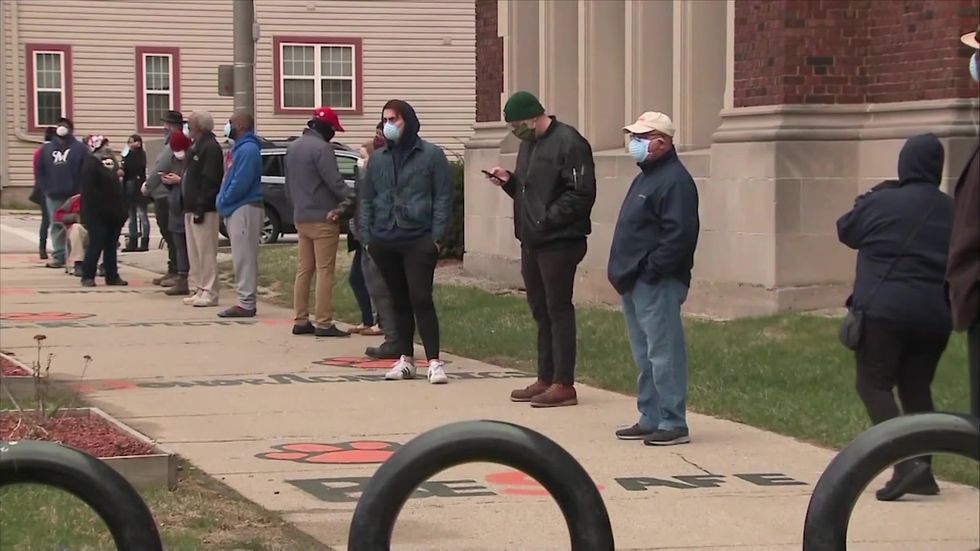 Long lines form outside Wisconsin polls despite coronavirus warnings