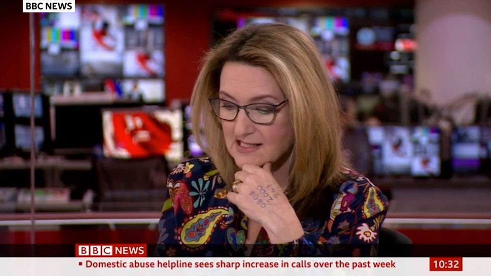 Victoria Derbyshire goes on TV with domestic abuse helpline number written on hand