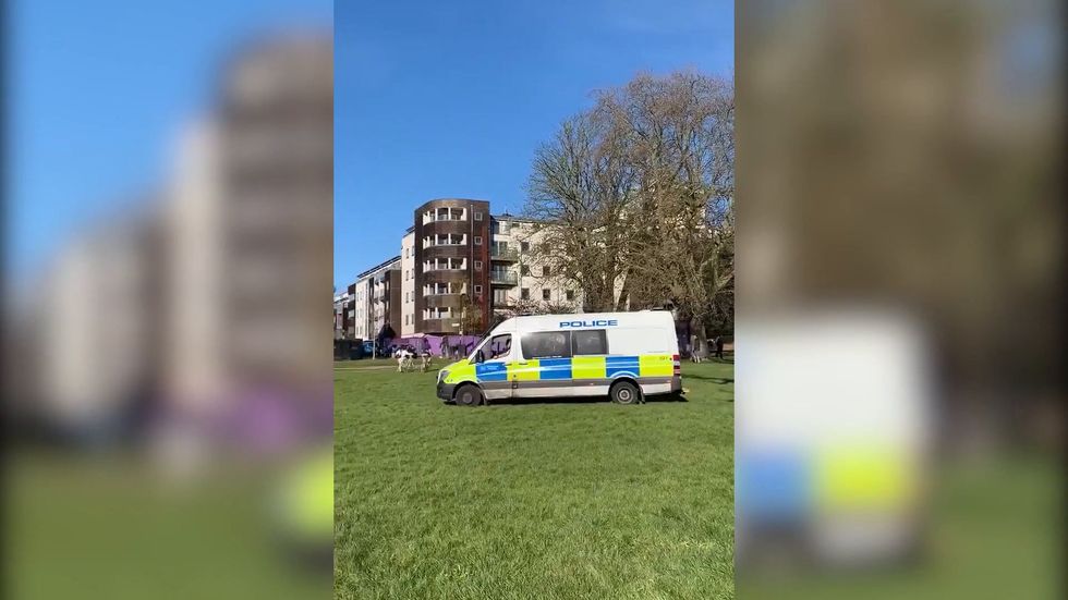 Police patrol parks and tell people not to sunbathe in London as sunny weather hits UK