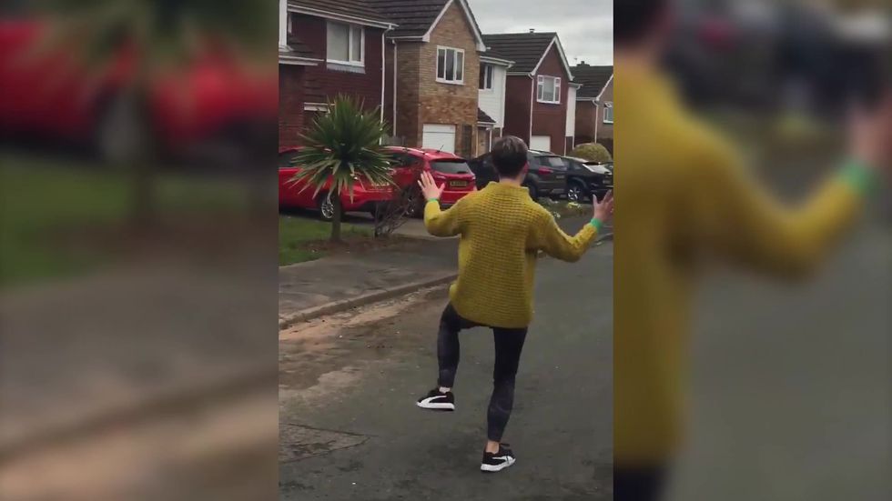 Neighbours take part in socially distant dancing on street every day