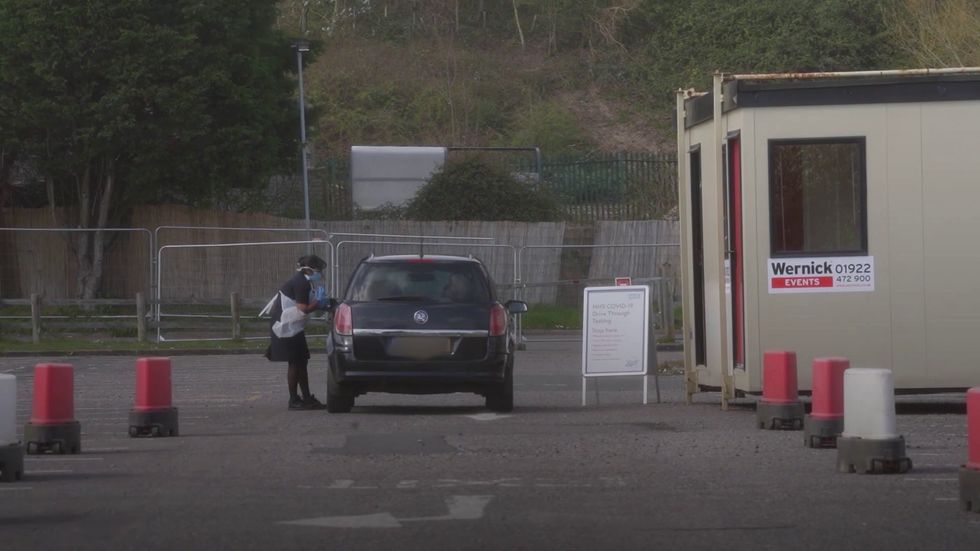NHS staff conduct Covid-19 tests at Chessington drive-through centre