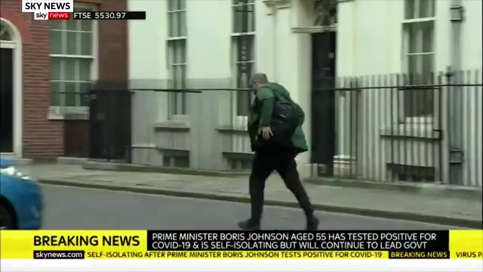 Dominic Cummings spotted running away from Downing Street shortly after PM tests positive for coronavirus