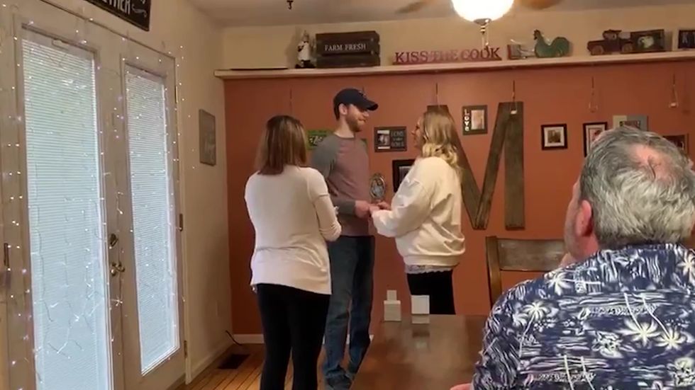 Couple hold a surprise wedding in their kitchen after cancellation