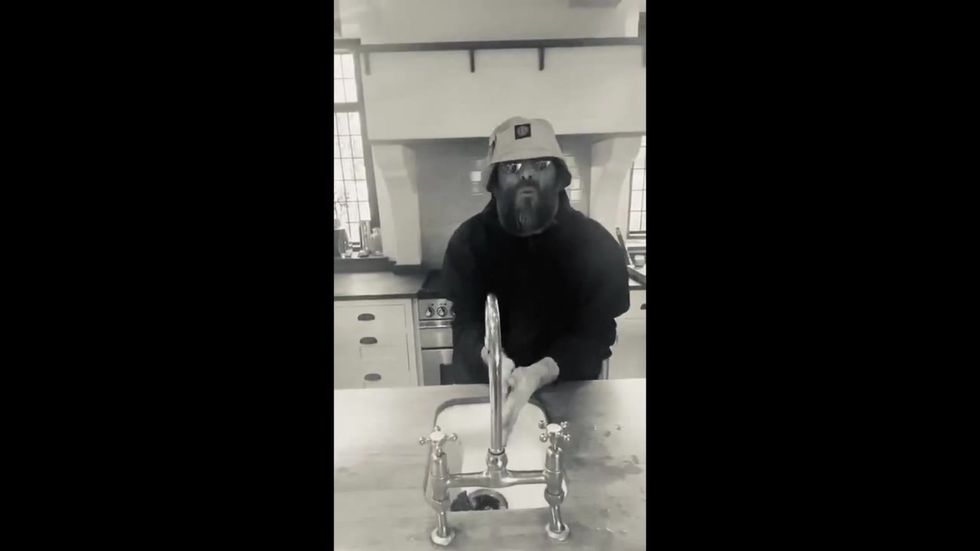 Liam Gallagher performs 'Soapersonic' while washing his hands